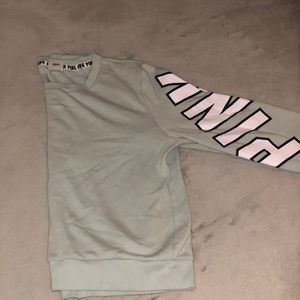 Mint green pink sweater.